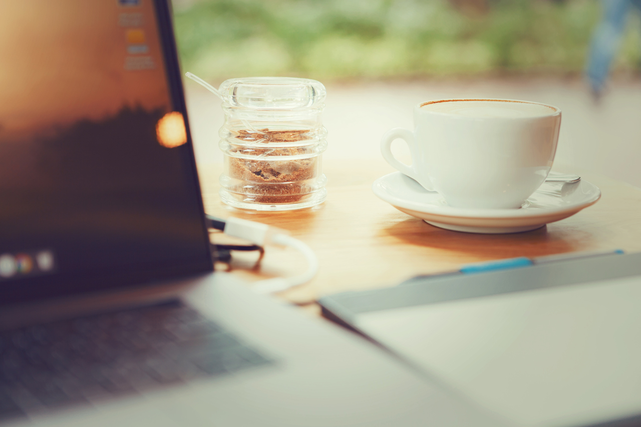 table with laptop and coffee